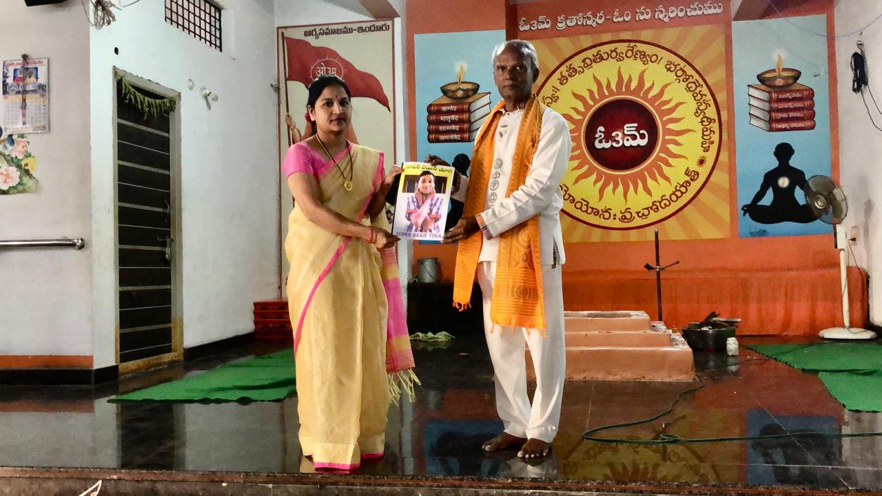 Presenting copy of research paper on "Super Brain Yoga" published in SCERT Compendium.