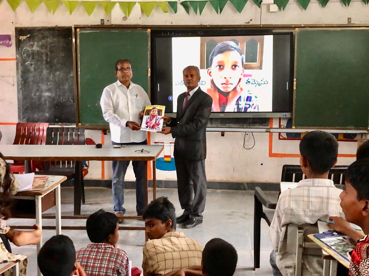 Presented the copy research paper published in SCERT Compendium  on  Super Brain Yoga-to Swami, MEO., & HM., ZPHS, Bheemgal