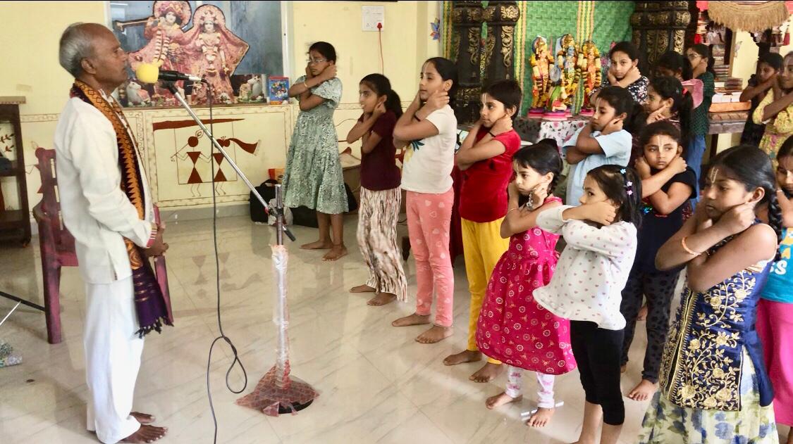 Devotees performing 14 rounds of Super Brain Yoga - Workshop on Super Brain Yoga at Samskara Summer Camp organized by ISKCON, Dwaraka Nagar, Nizamabad.