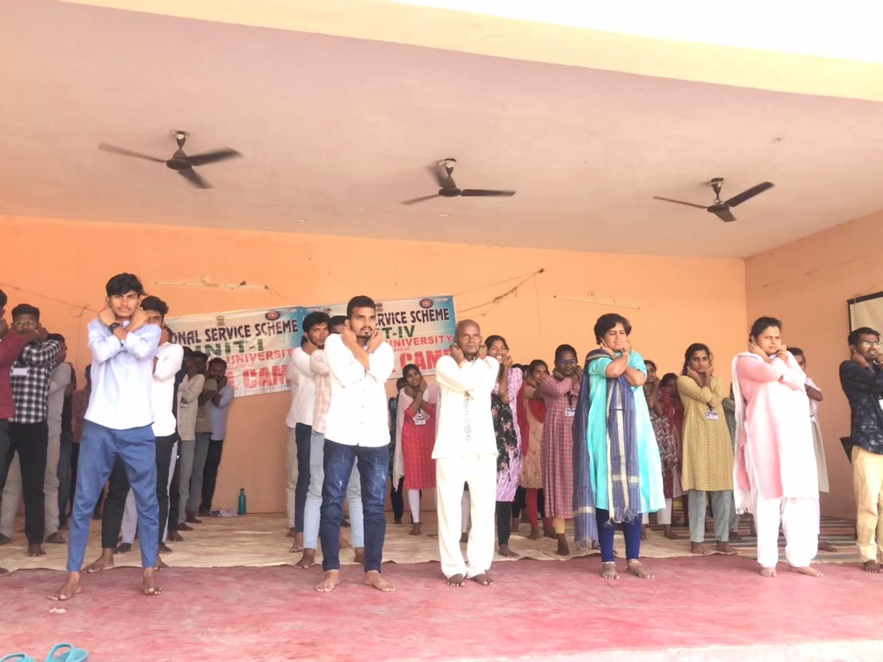 POs and volunteers performing 14 rounds of Super Brain Yoga at Telangana University NSS I & IV units Special Camp organized at Suddapally village.