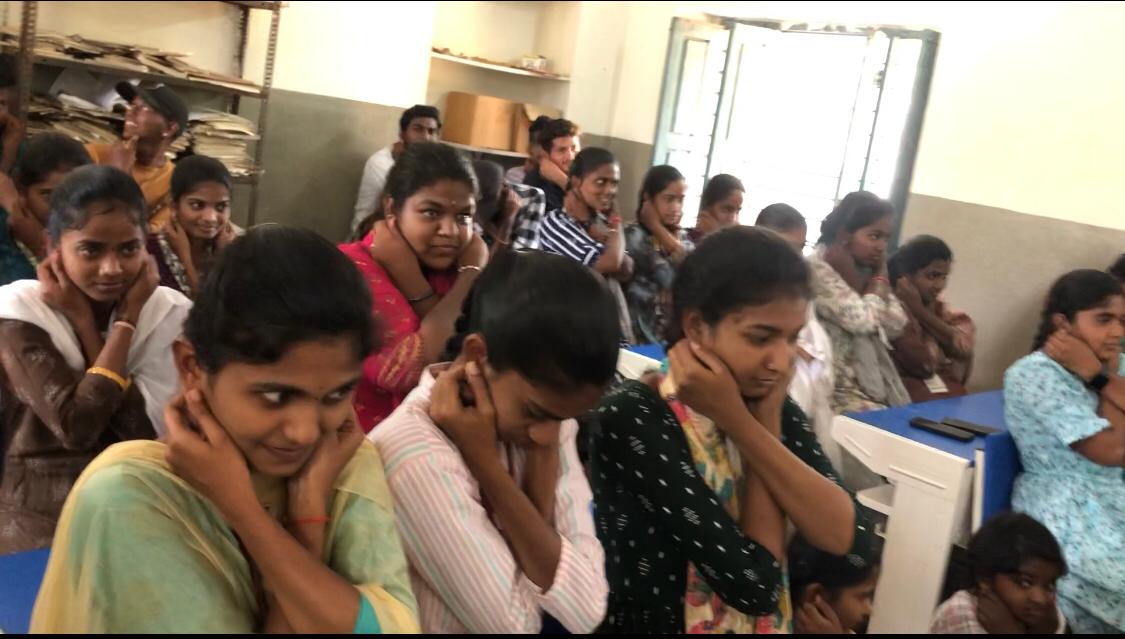 Positioning of fingers on earlobes-Workshop on Super Brain Yoga at NSS Unit-I, Govt. Degree College, Dhatpally Special Camp organized at Seethaipet village, Dharpally Mandal.
