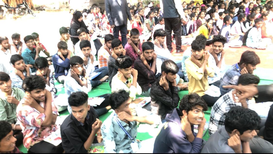 Positioning of fingers on earlobes-Workshop on Super Brain Yoga at Govt. Junior College, Narayan Khed, Sanga Reddy Dist.