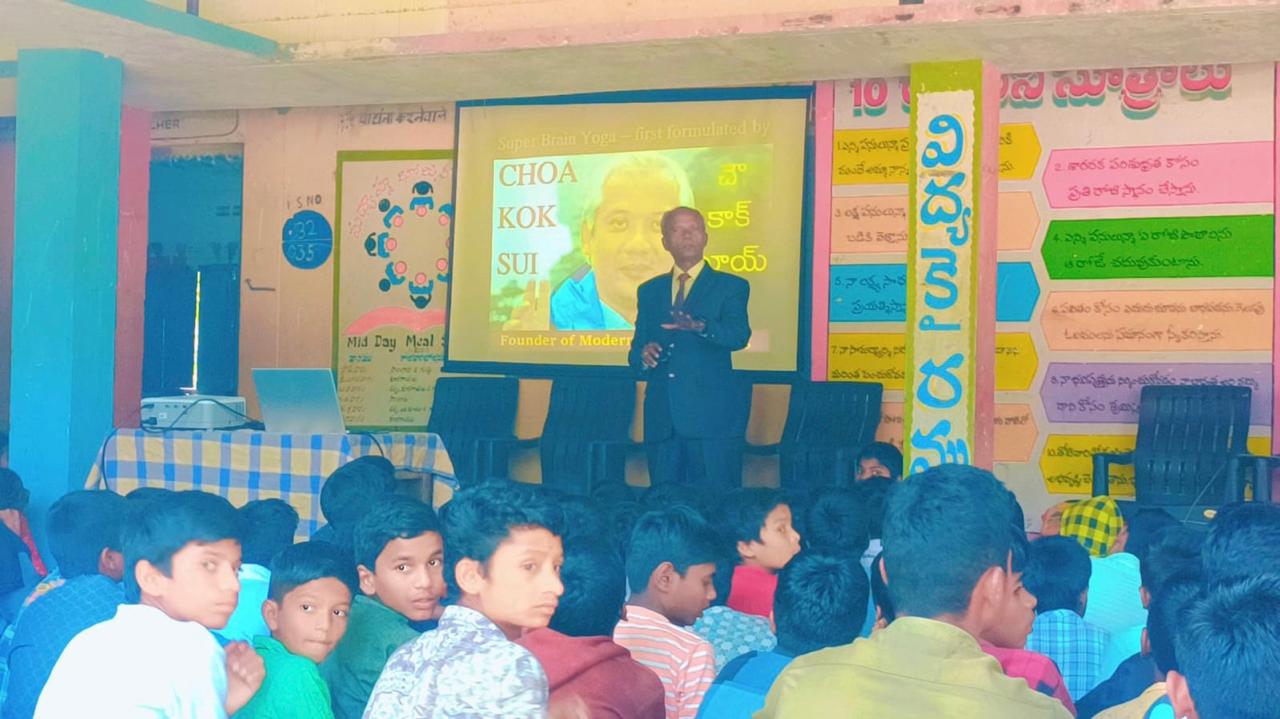 Explaining the benefits of Super Brain Yoga at Zilla Parishad High School, Kalhair, Sanga Reddy Dist.