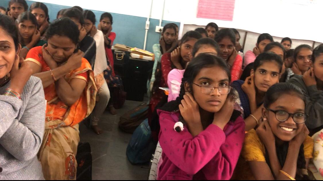 Positioning of fingers on earlobes - Workshop on Super Brain Yoga at Zilla Parishad Girls High School, Chinna Malla Reddy, Kama Reddy Dist.