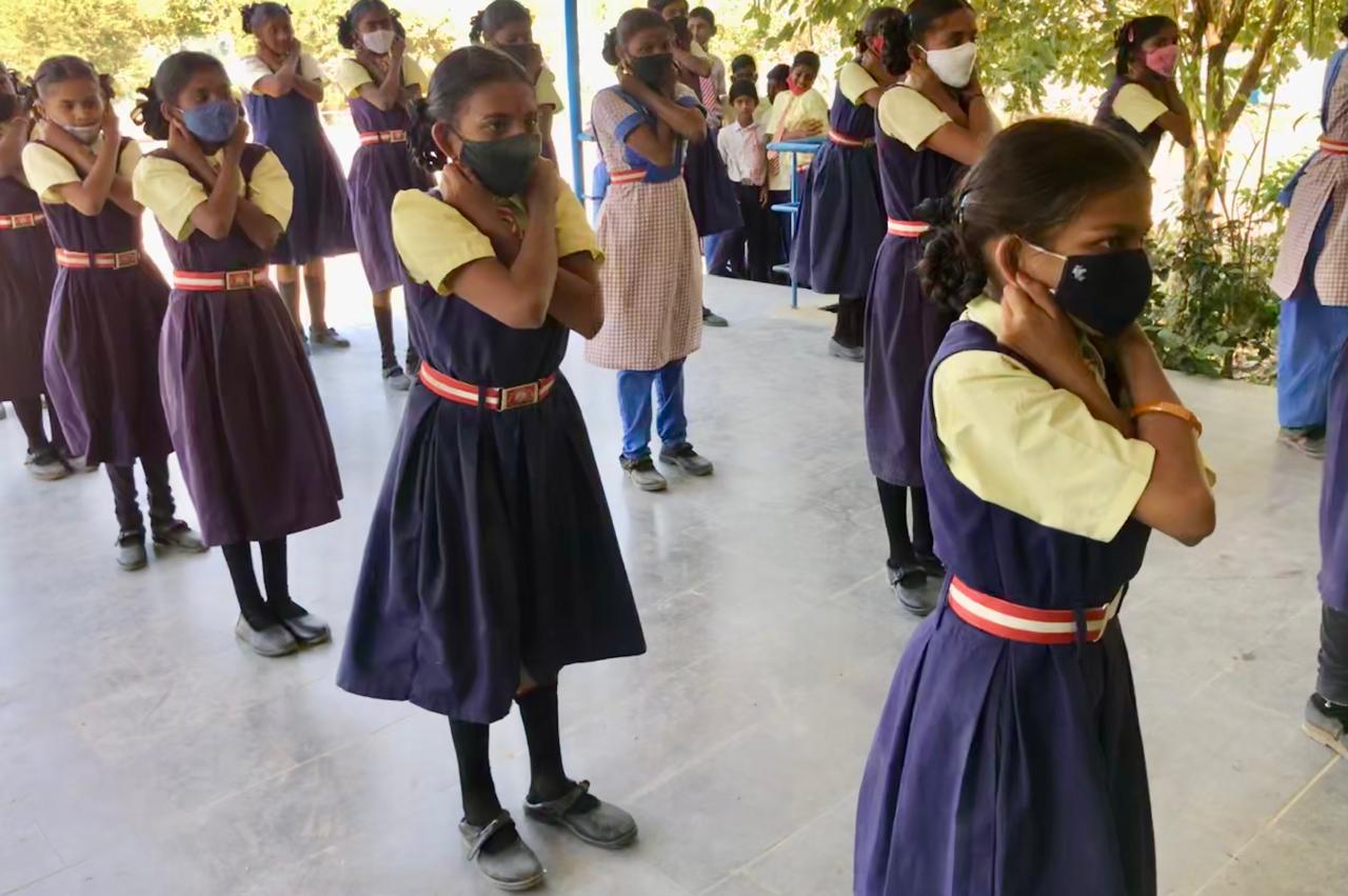 Students performing 14 rounds of  Super Brain Yoga - Workshop on Super Brain Yoga at Zilla Parishad High School, Maggidi, Nizamabad Dist.