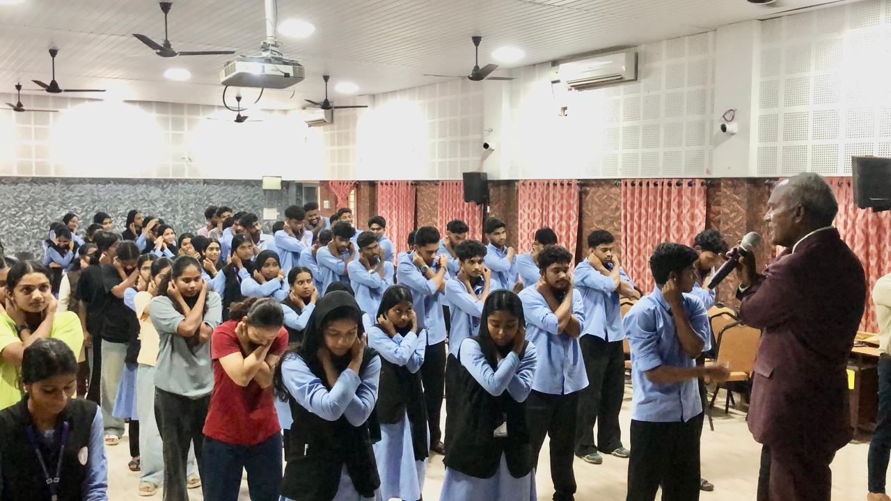 Students performing  Super Brain Yoga at MES Ponnani College, Ponnani, Kerala state.