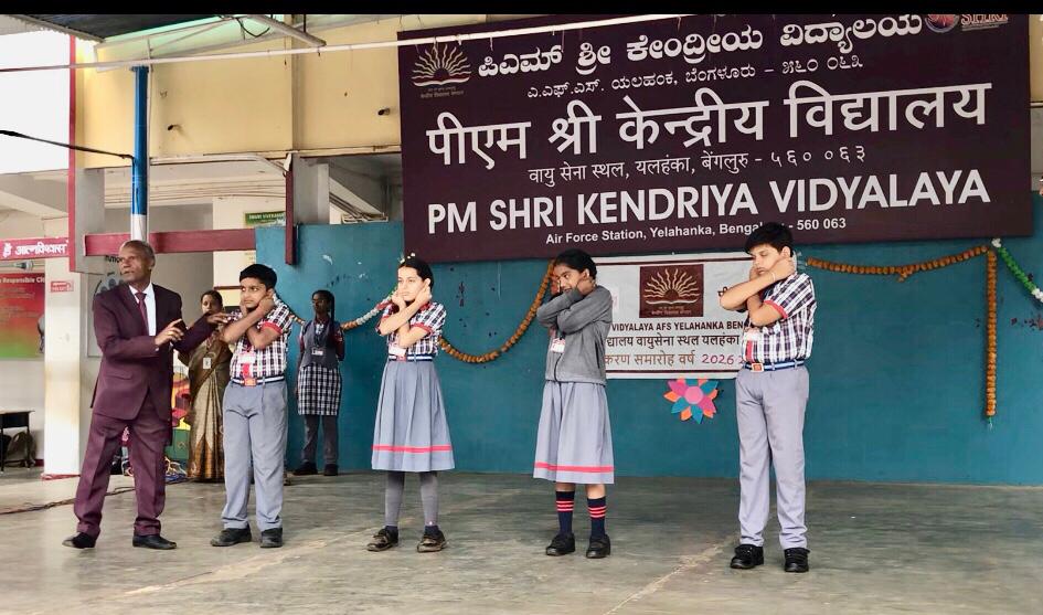 Positioning of fingers on earlobes - Workshop on Super Brain Yoga at PM Sri Kendriya Vidyalaya, Air Force Station, Yelhanka, Bangalore, Karnataka state.
