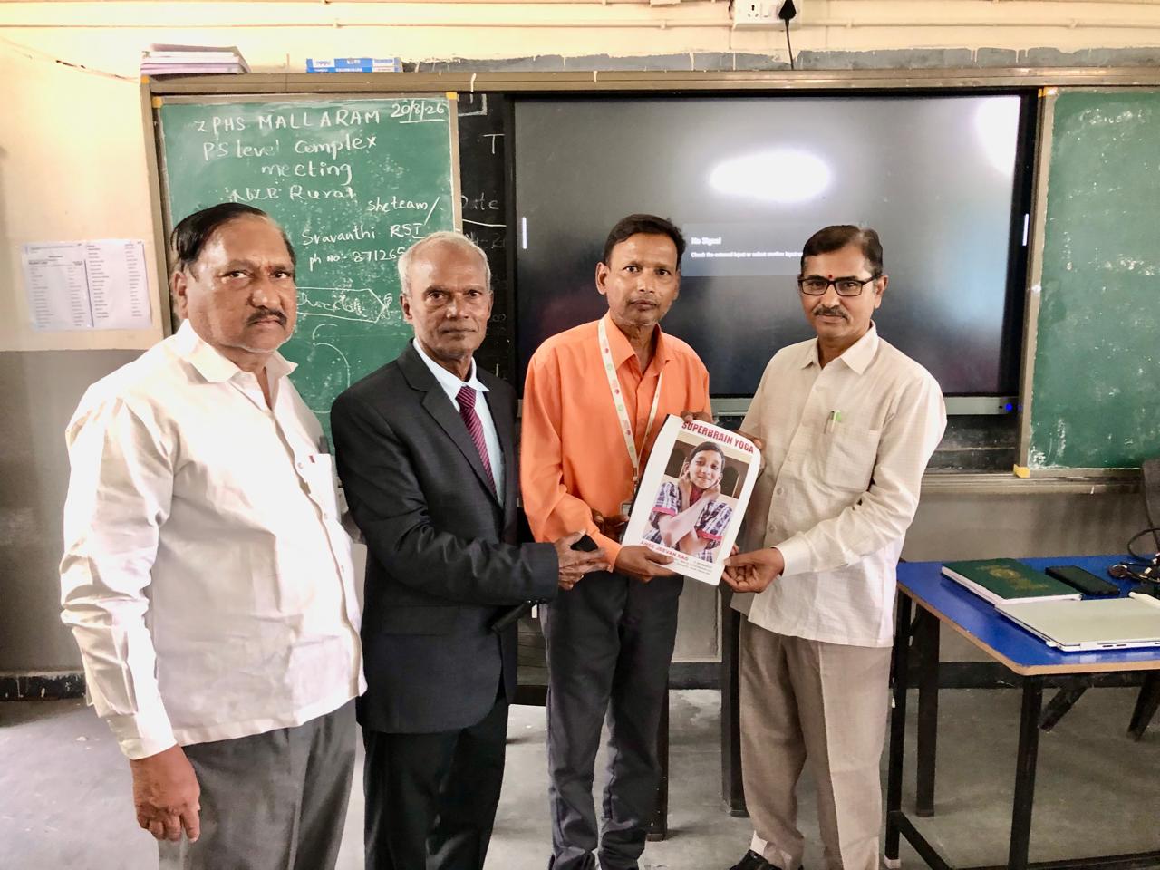 Copy of article on Super Brain Yoga published in SCERT Compendium was presented to Mandal Education Officer Sri. Sevalal - Workshop on  Super Brain Yoga at P.M. Sri Zilla Parishad High School, MALLARAM, Nizamabad Mandal & District.