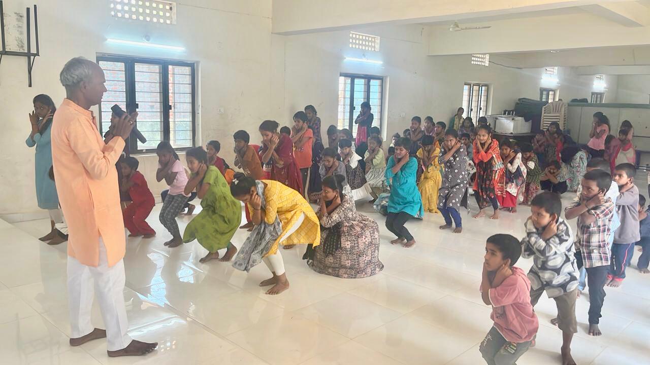 Students performing 14 rounds of Super Brain Yoga as part of workshop at Manavatha Sadan, Dichpally organized by National service Scheme as part of 100 days action plan.