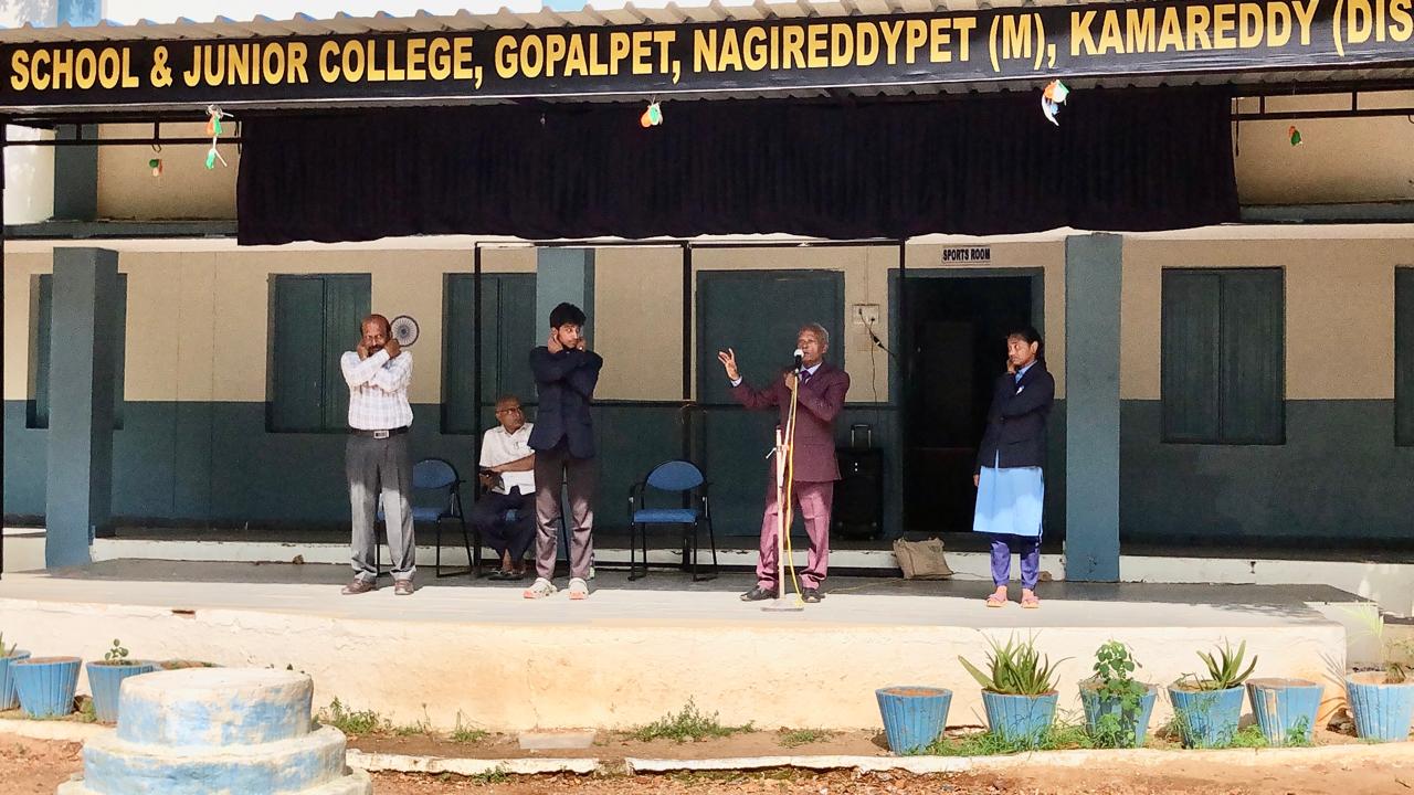 Demonstration of positioning of fingers on earlobes - Workshop on Super Brain Yoga at Telangana Model School & Junior College, Gopal Pet, Nagireddy Per Mandal, Kamareddy Dist., sponsored by International Lions Club of Nizamabad-Netha.