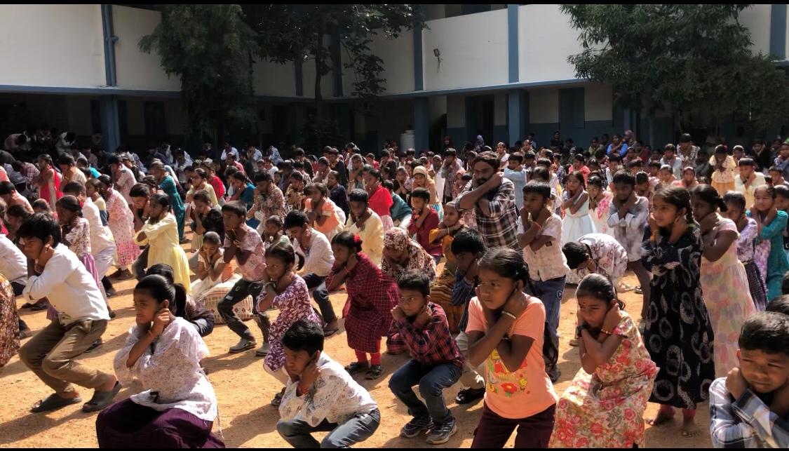 Students performing Super Brain Yoga - Workshop on Super Brain Yoga at Telangana Model School & Junior College, Gopal Pet, Nagireddy Per Mandal, Kamareddy Dist., sponsored by International Lions Club of Nizamabad-Netha.