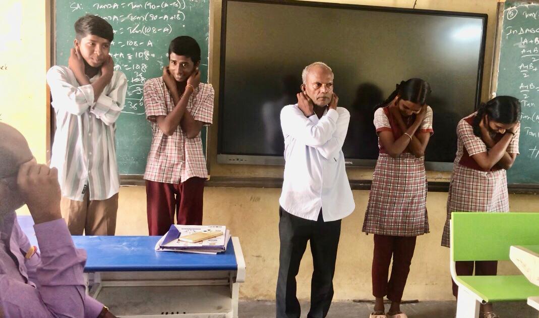Demonstration of positioning of fingers on earlobes - Workshop on Super Brain Yoga at Zilla Parishad High School, KESAEA, Medchal - Malkajgiri Dist.