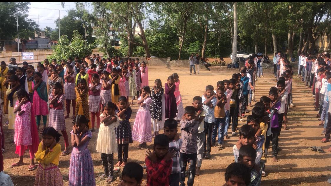 Positioning of arms on abdomen during Super Brain Yoga - Workshop on  Super Brain Yoga at Zilla Parishad High School, Gopalpet, Nagireddy Pet Mandal sponsored by International  Lions Club of Nizamabad-Netha.