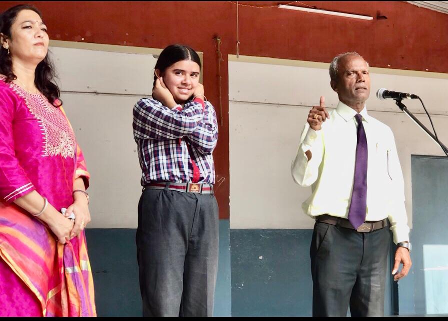 Demo positioning of fingers on earlobes - Workshop on Super Brain Yoga at Kendriya Vidyalaya, FRI, Dehradun, Uttarakhand state.